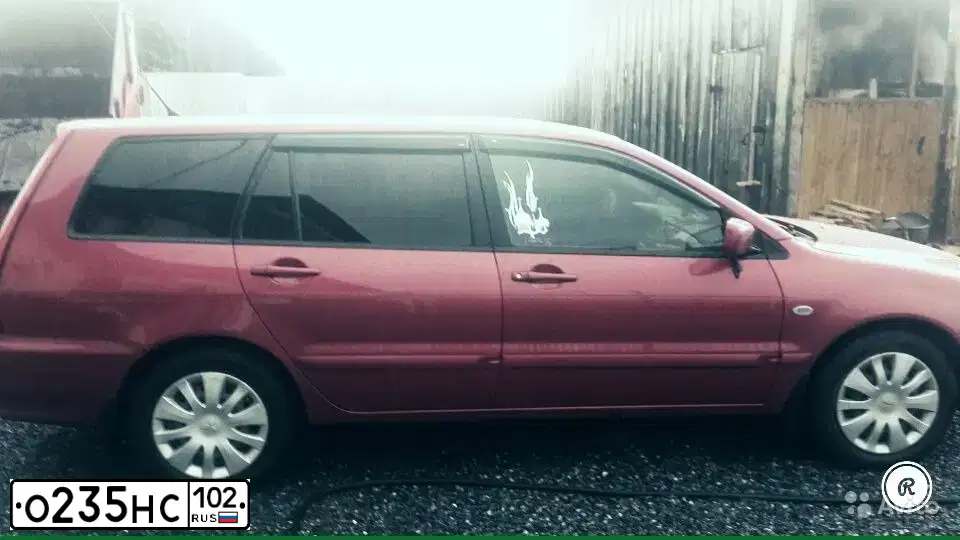 Фото автомобиля MITSUBISHI LANCER, 2005 — госномер К007ВА774. Цвет: Красный