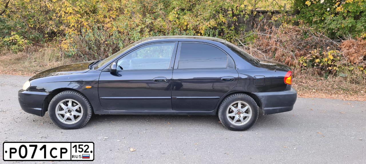 Фото автомобиля KIA SPECTRA, 2007 — госномер М153УО716. Цвет: ЧЕРНЫЙ
