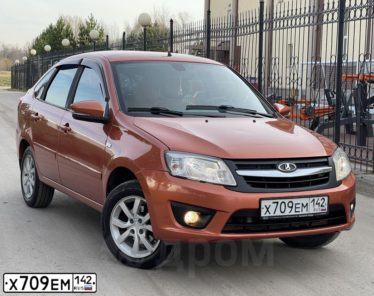 Фото автомобиля LADA 2191 GRANTA, 2015 — госномер Х709ЕМ142. Цвет: Оранжевый