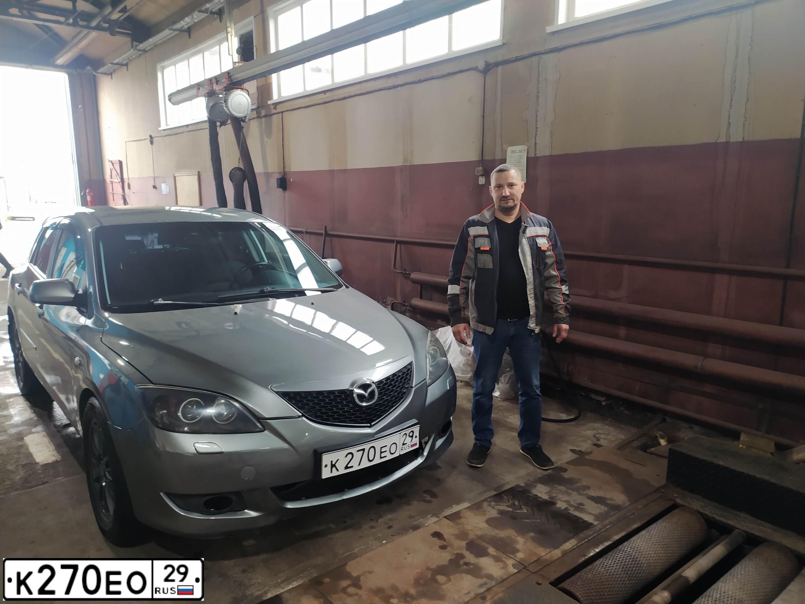 Фото автомобиля MAZDA 3, 2005 — госномер К270ЕО29. Цвет: СВЕТЛО-СЕРЫЙ