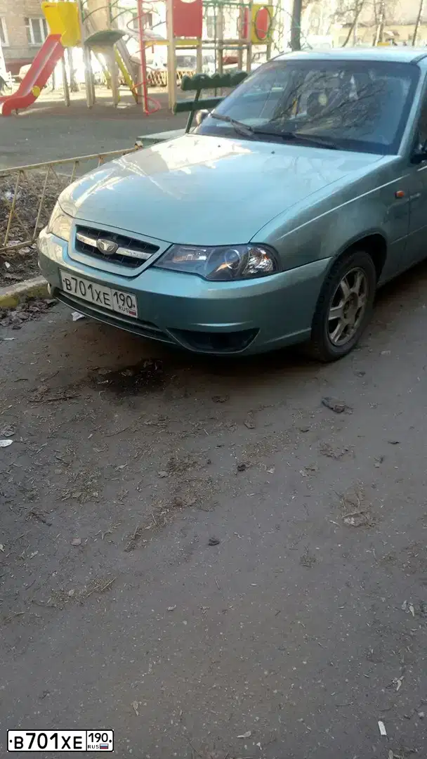 Фото автомобиля DAEWOO NEXIA, 2009 — госномер В701ХЕ190. Цвет: ЗЕЛЕНЫЙ