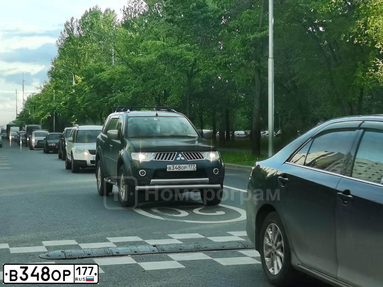 Фото автомобиля MITSUBISHI PAJERO SPORT, 2012 — госномер Р299ЕР977. Цвет: СЕРЫЙ ТЕМНЫЙ