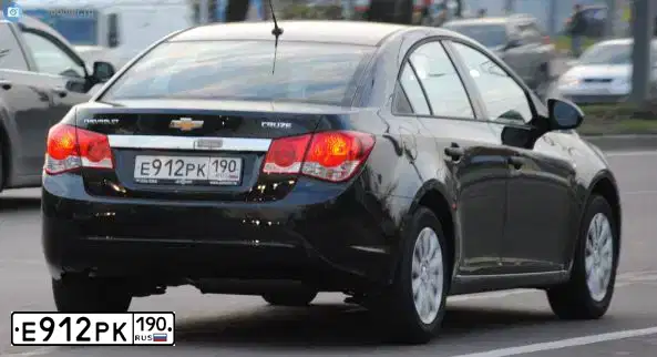 Фото автомобиля CHEVROLET CRUZE, 2011 — госномер Е912РК190. Цвет: ЧЕРНЫЙ