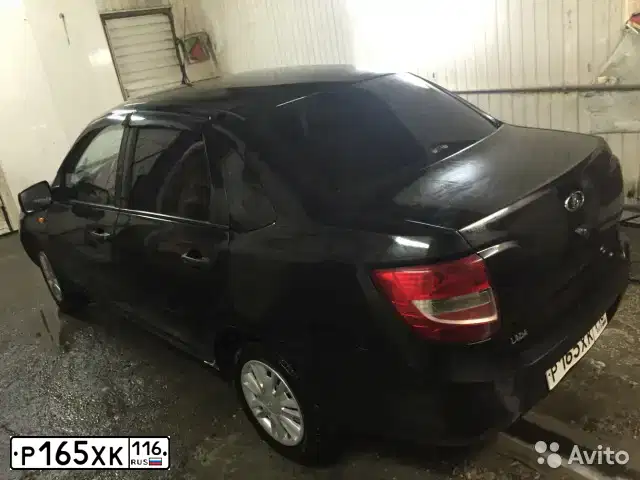 Фото автомобиля LADA 2190 GRANTA, 2012 — госномер М295РН73. Цвет: СИНЕ-ЧЕРНЫЙ