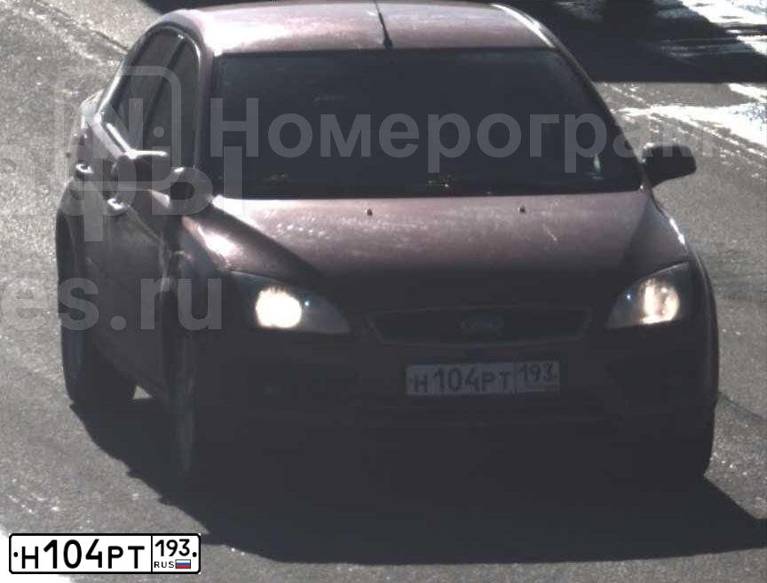 Фото автомобиля FORD FOCUS, 2006 — госномер Н104РТ193. Цвет: КРАСНО-ОРАНЖЕВЫЙ