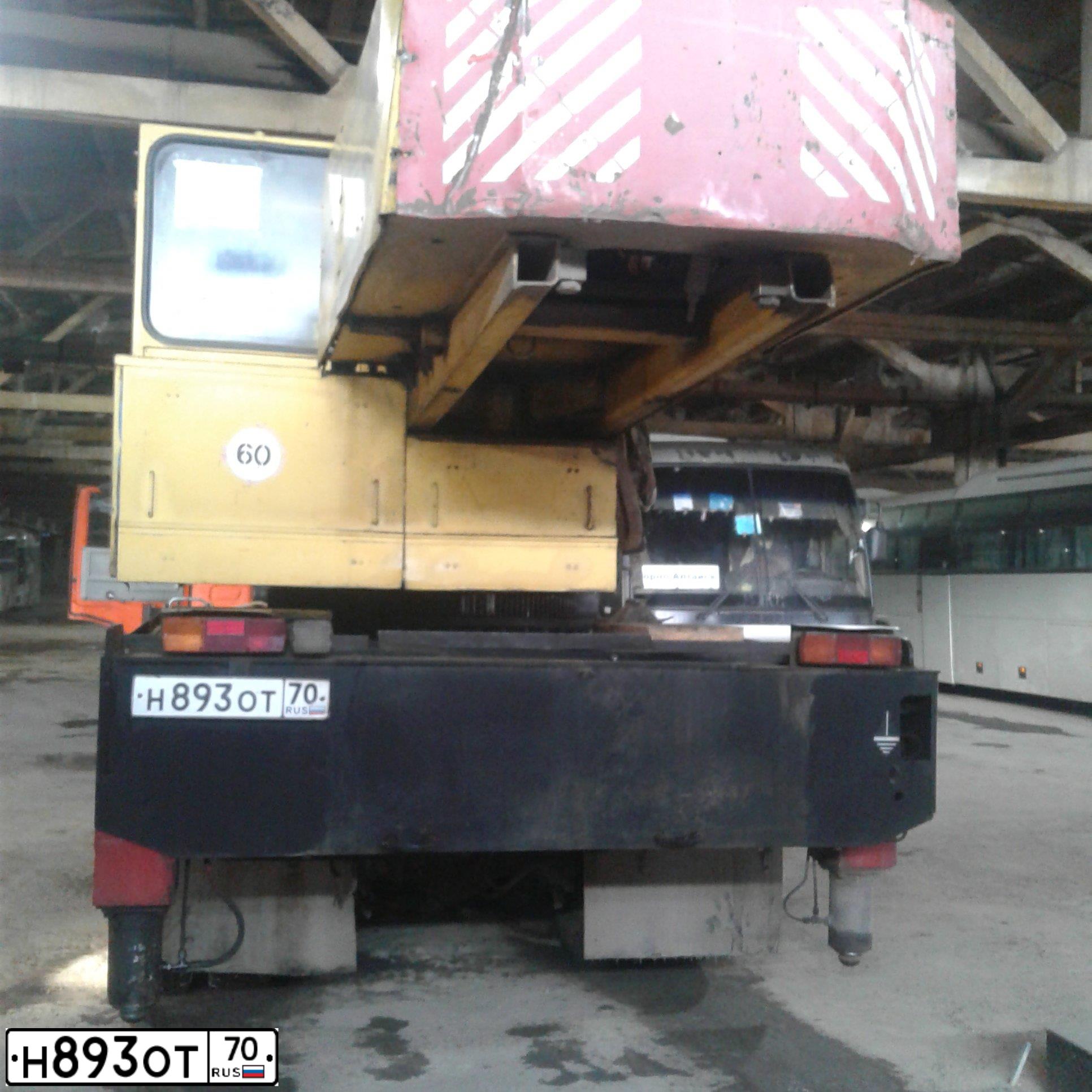 Фото автомобиля KAMAZ 53215 /6X4/, 2001 — госномер Н893ОТ70. Цвет: ОРАНЖЕВЫЙ
