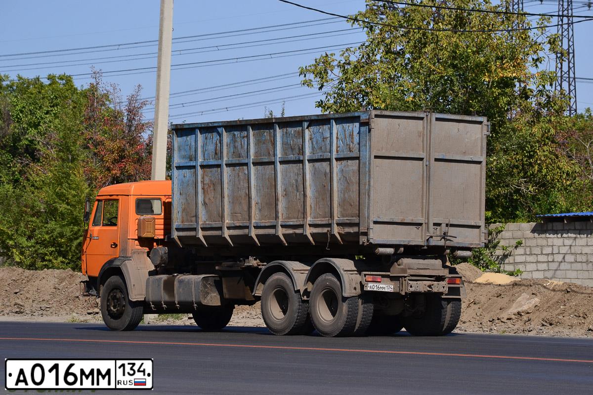 Фото автомобиля KAMAZ 65117 /6X4/, 2007 — госномер М100ВХ98. Цвет: ОРАНЖЕВЫЙ
