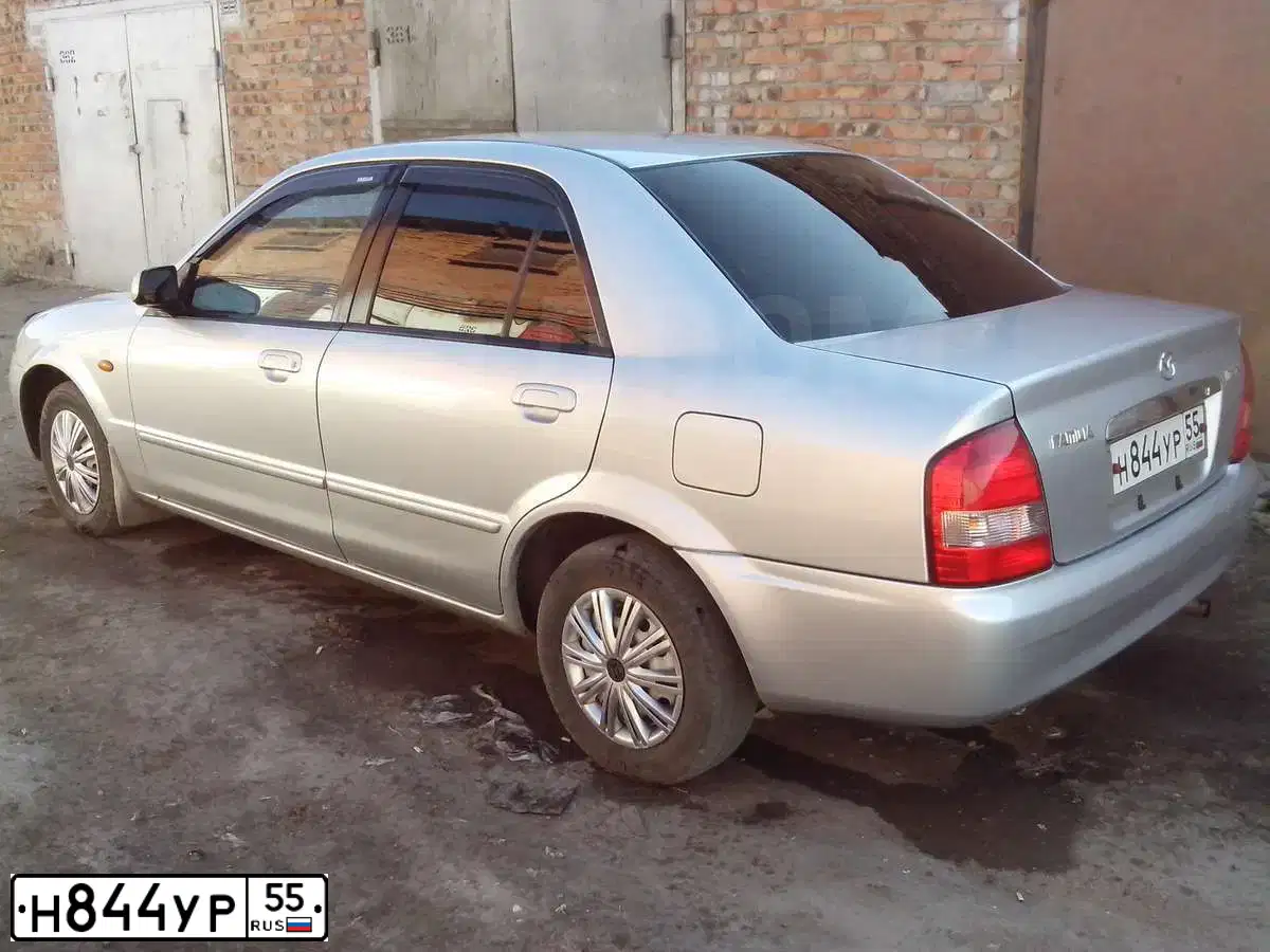 Фото автомобиля MAZDA FAMILIA, 2003 — госномер Н844УР55