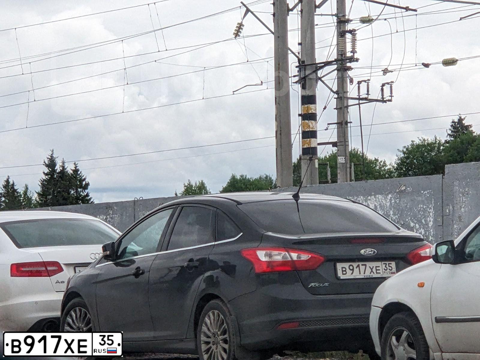 Фото автомобиля FORD FOCUS, 2012 — госномер В917ХЕ35. Цвет: ЧЕРНЫЙ