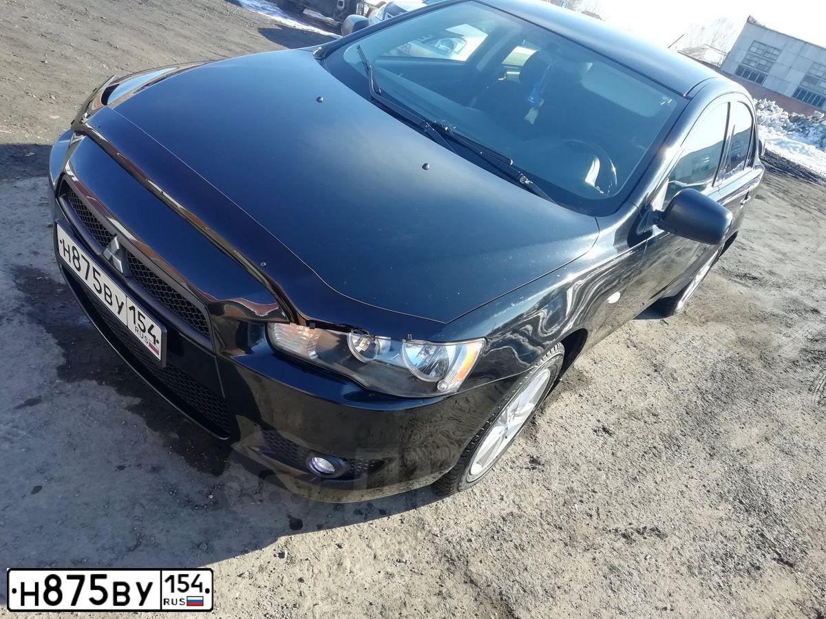 Фото автомобиля MITSUBISHI LANCER, 2008 — госномер Х766ХА55. Цвет: ЧЕРНЫЙ