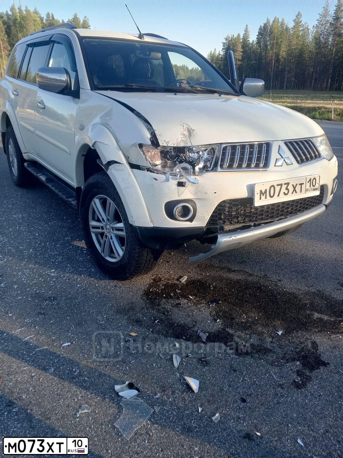 Фото автомобиля MITSUBISHI PAJERO SPORT, 2012 — госномер М073ХТ10. Цвет: Белый
