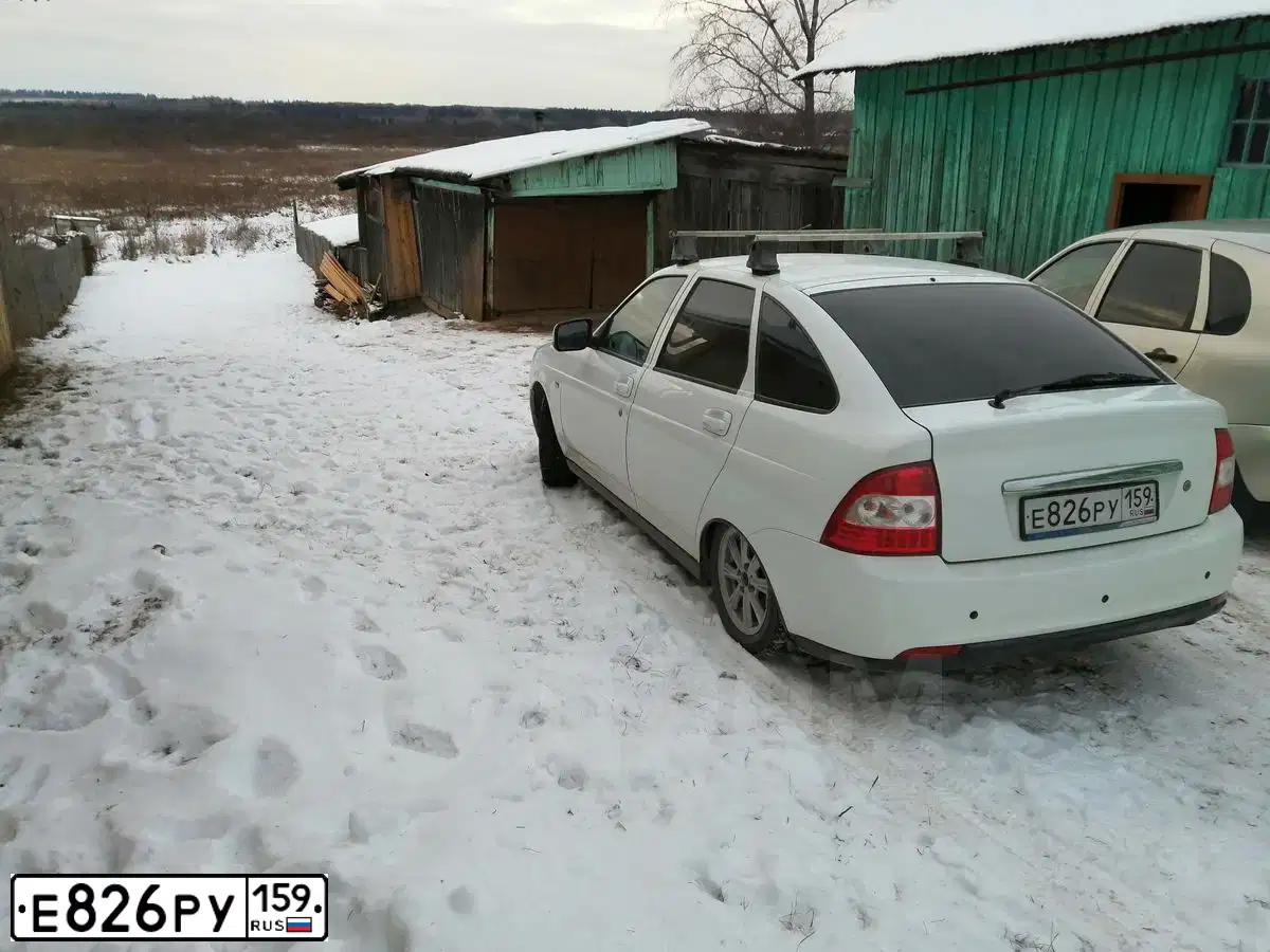 Фото автомобиля LADA 2172 PRIORA, 2014 — госномер Р512АН05. Цвет: Белый