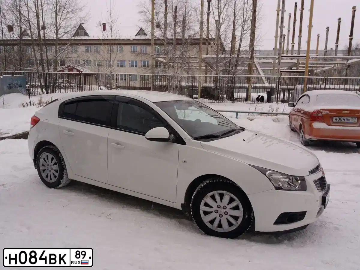 Фото автомобиля CHEVROLET AVEO, 2007 — госномер Н084ВК89. Цвет: ОРАНЖЕВЫЙ