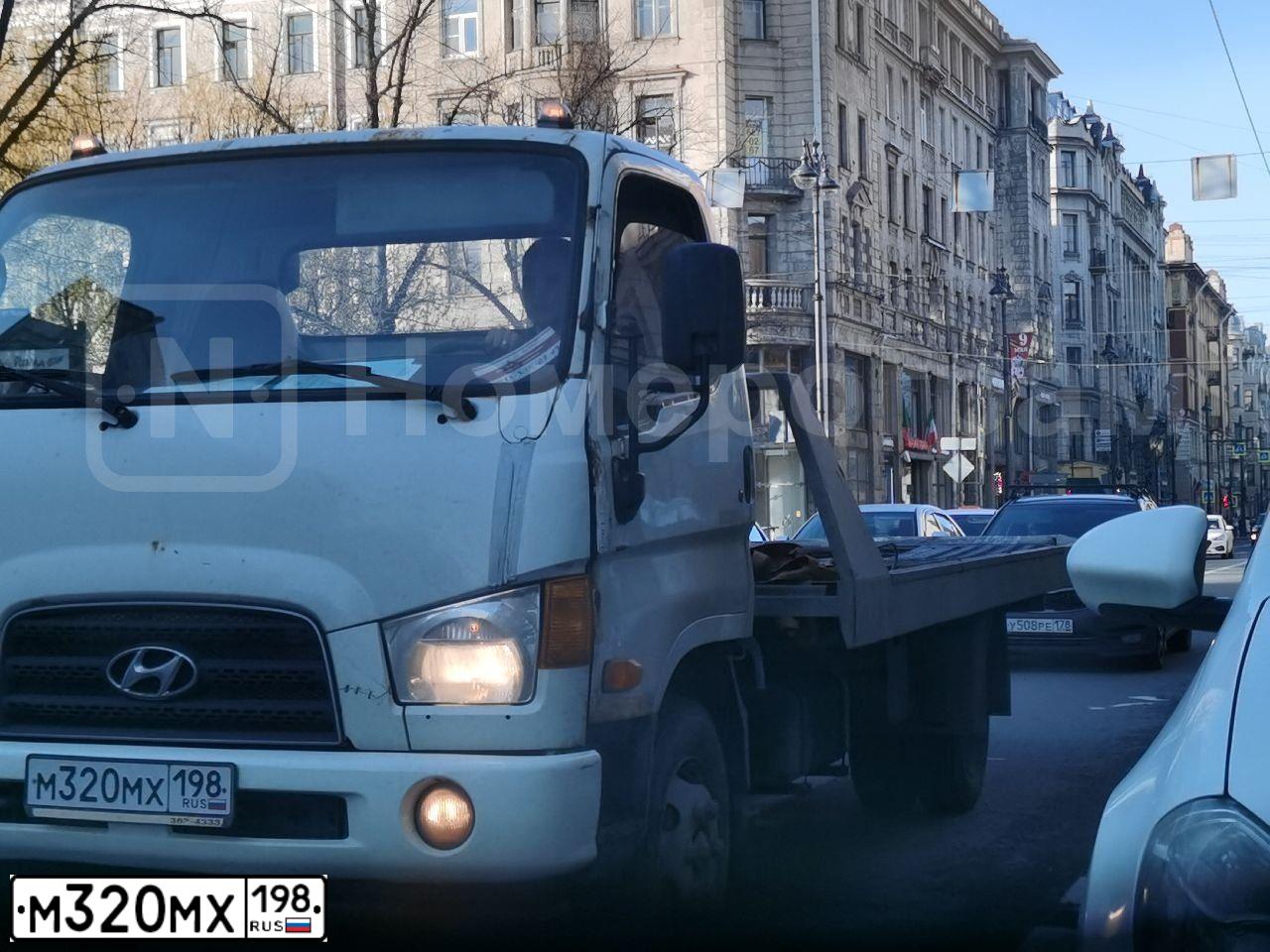Фото автомобиля HYUNDAI MIGHTY, 2012 — госномер М320МХ198. Цвет: СИНИЙ