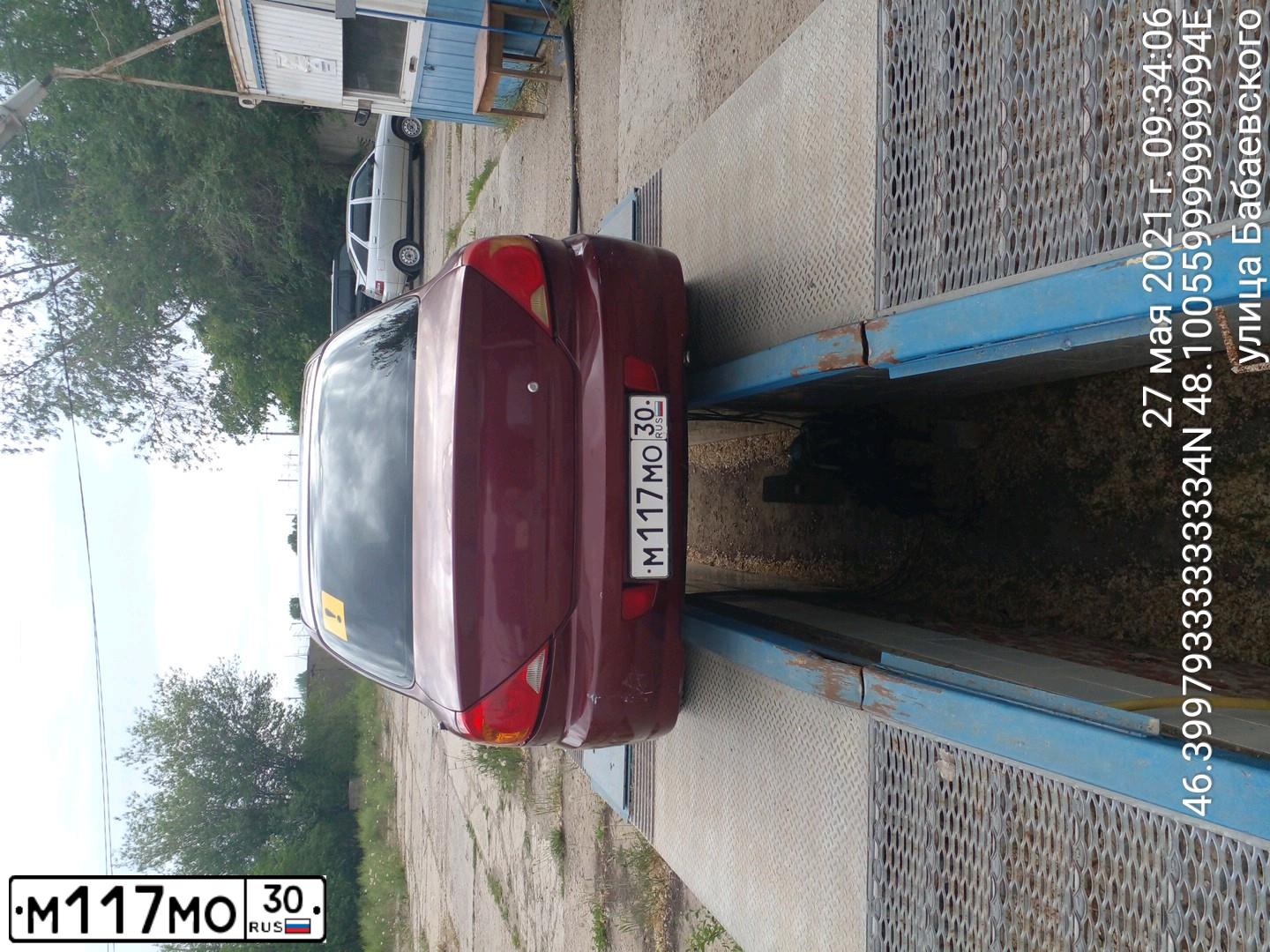 Фото автомобиля KIA SPECTRA, 2007 — госномер Н440НМ30. Цвет: Красный