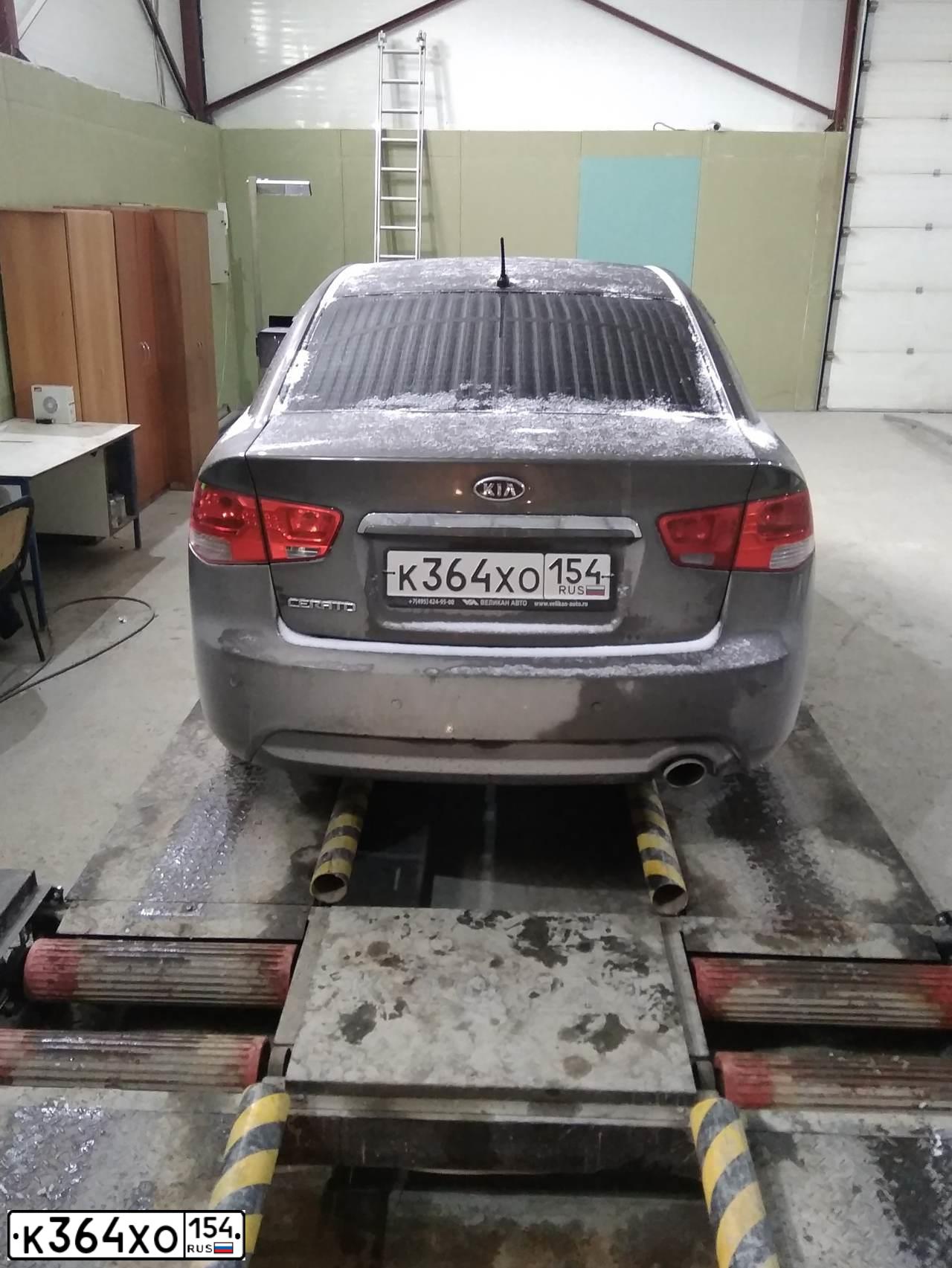 Фото автомобиля KIA CERATO, 2009 — госномер К967КМ154. Цвет: бронзовый