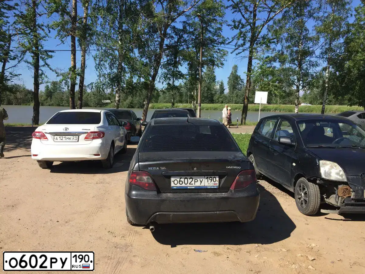 Фото автомобиля DAEWOO NEXIA, 2011 — госномер Н911МЕ10. Цвет: Бледно-Черный