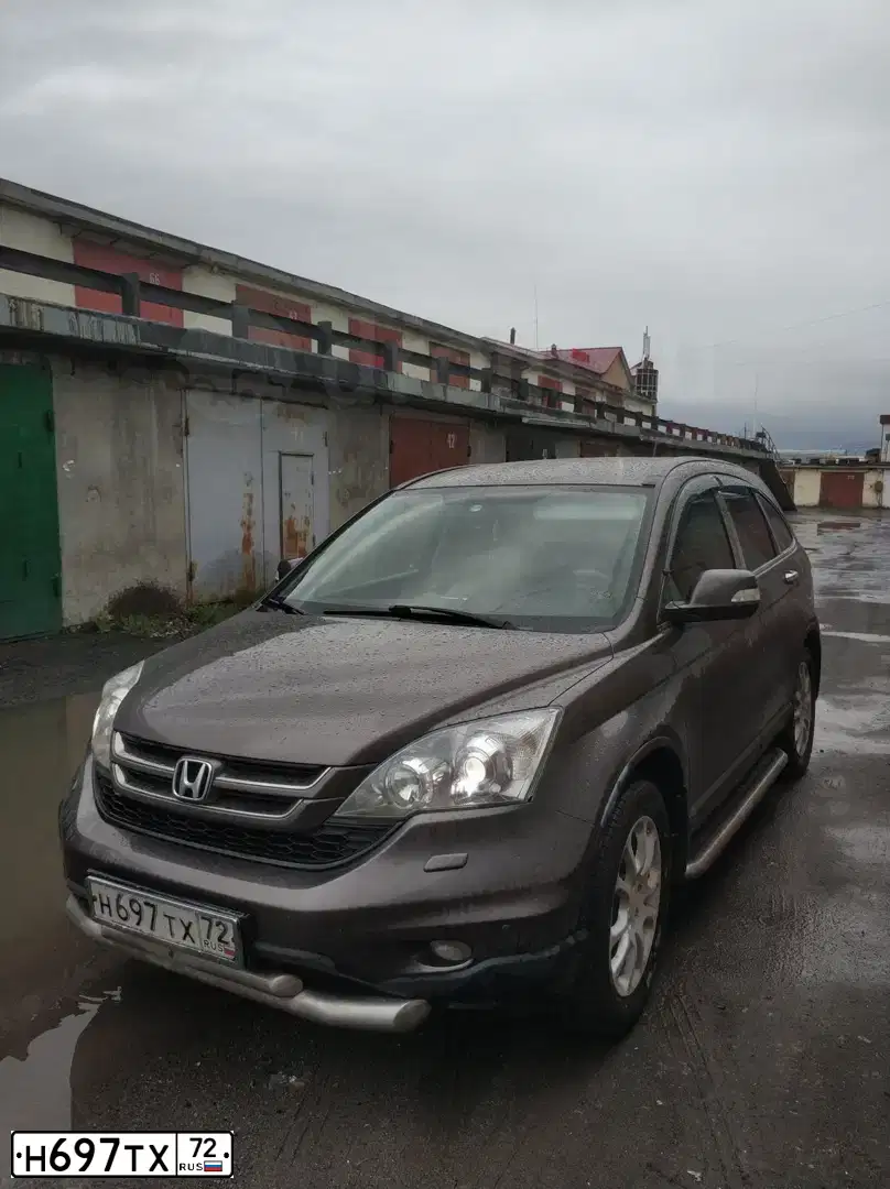 Фото автомобиля HONDA CR-V, 2011 — госномер Н697ТХ72. Цвет: СЕРО-КОРИЧНЕВЫЙ