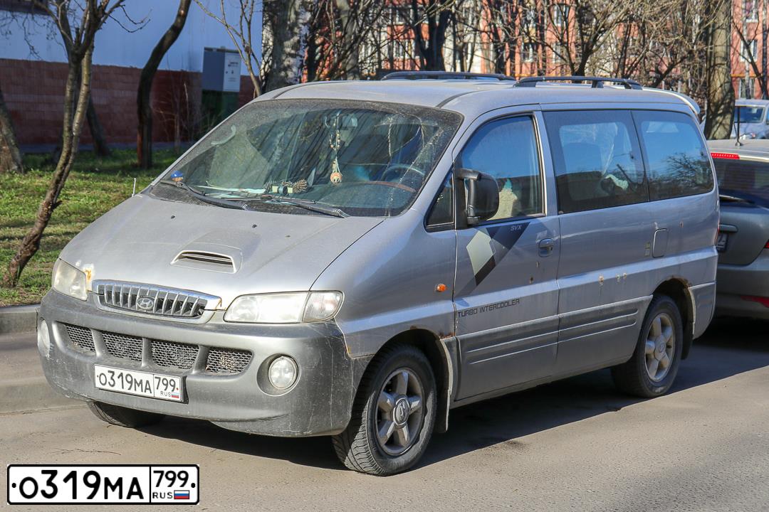 Фото автомобиля HYUNDAI H 1/H 100/STAREX, 2003 — госномер О319МА799. Цвет: ТЕМНО-СЕРЫЙ