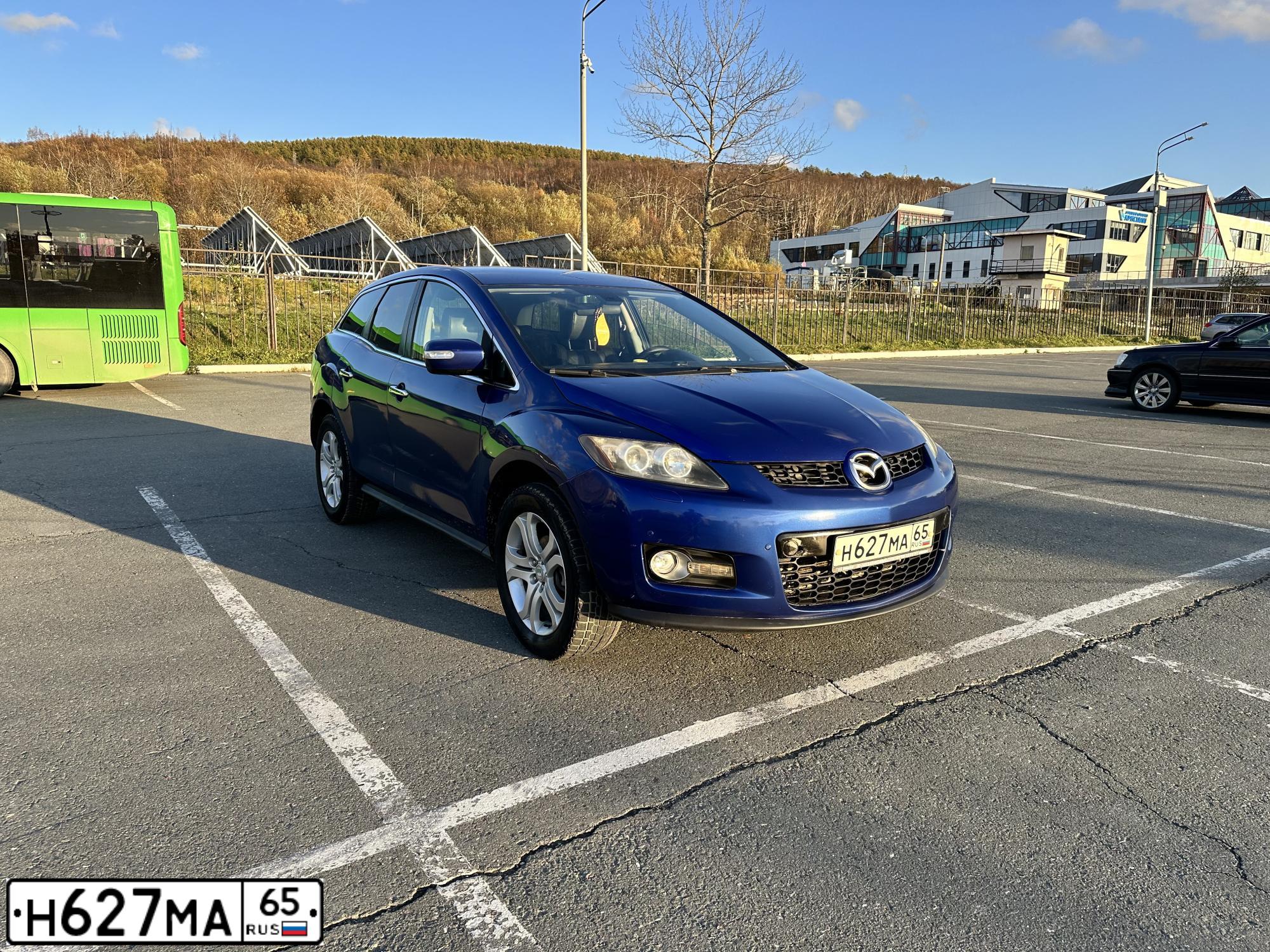 Фото автомобиля MAZDA CX-7, 2007 — госномер Н627МА65. Цвет: синий