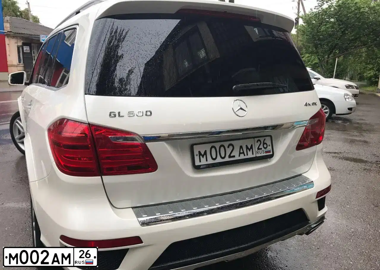 Фото автомобиля LEXUS LX, 2013 — госномер М002АМ26. Цвет: ЧЕРНЫЙ