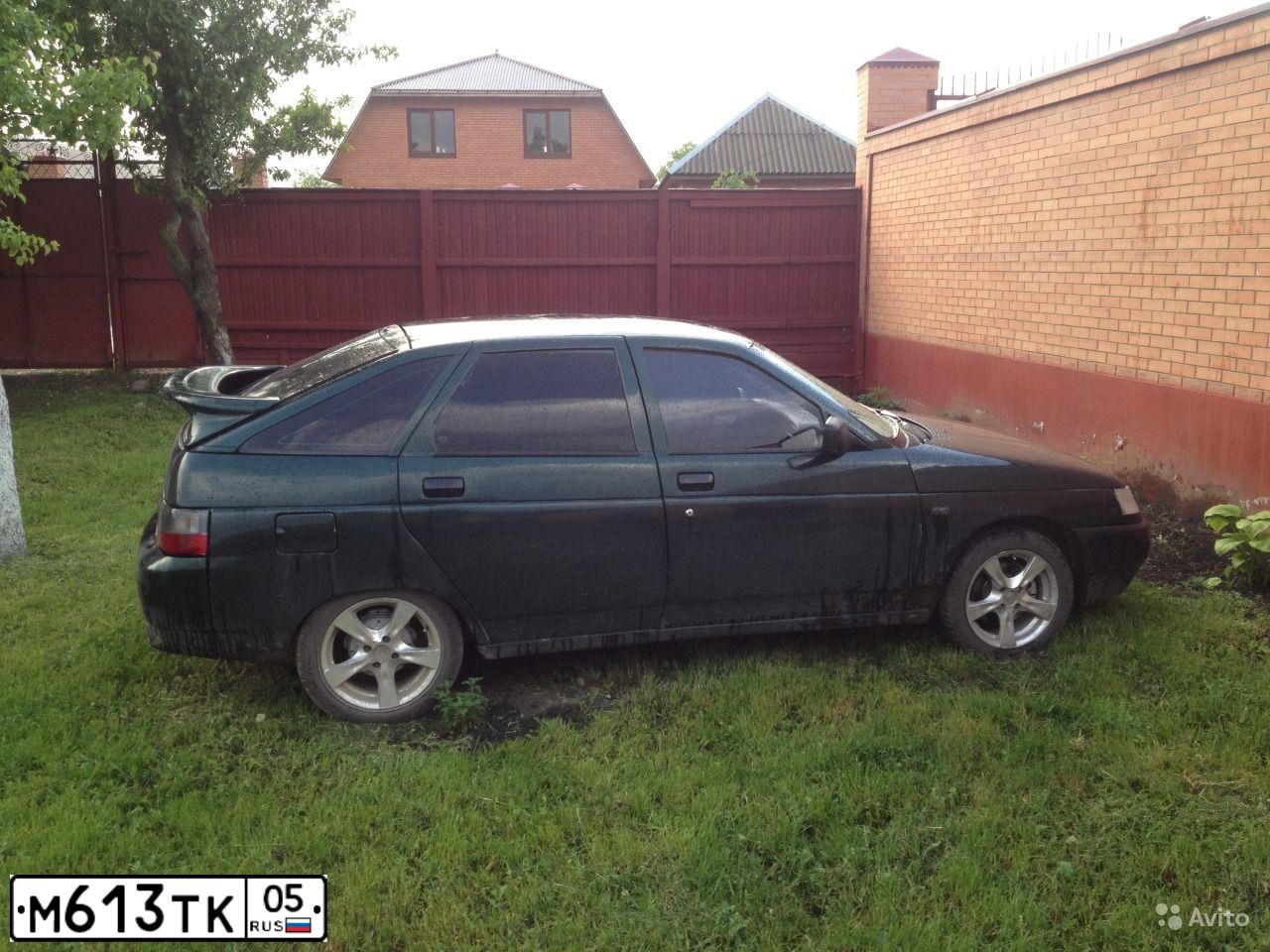 Фото автомобиля LADA 2112, 2004 — госномер М613ТК05. Цвет: ТЕМНО-ЗЕЛЕНЫЙ