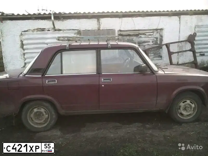 Фото автомобиля LADA 2107, 2004 — госномер Р661РО55. Цвет: ТЕМНО-КРАСНЫЙ