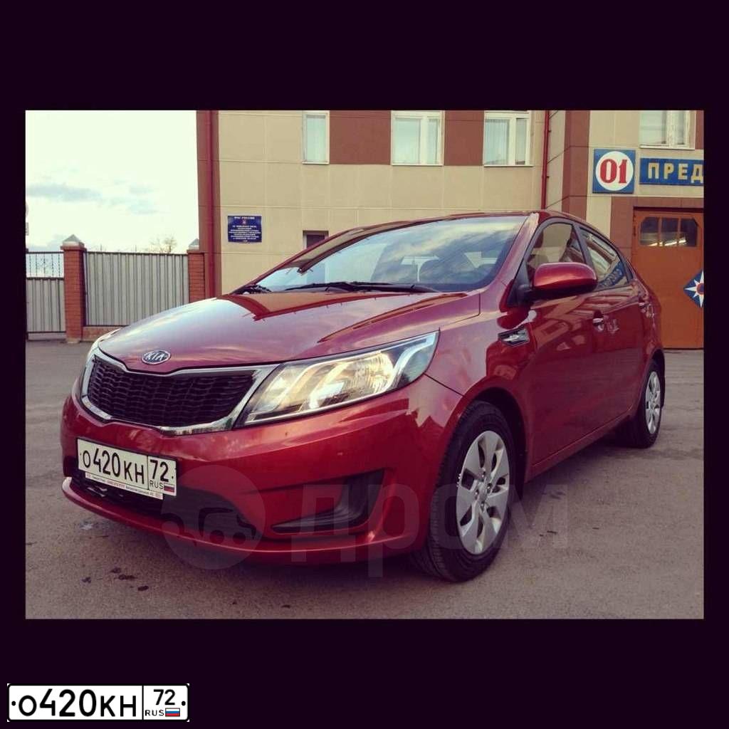 Фото автомобиля KIA RIO, 2012 — госномер Х523СЕ72. Цвет: Красный