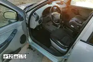 Фото автомобиля LADA 1118 KALINA, 2008 — госномер Т212СК73. Цвет: БЕЖЕВО-СЕРЫЙ