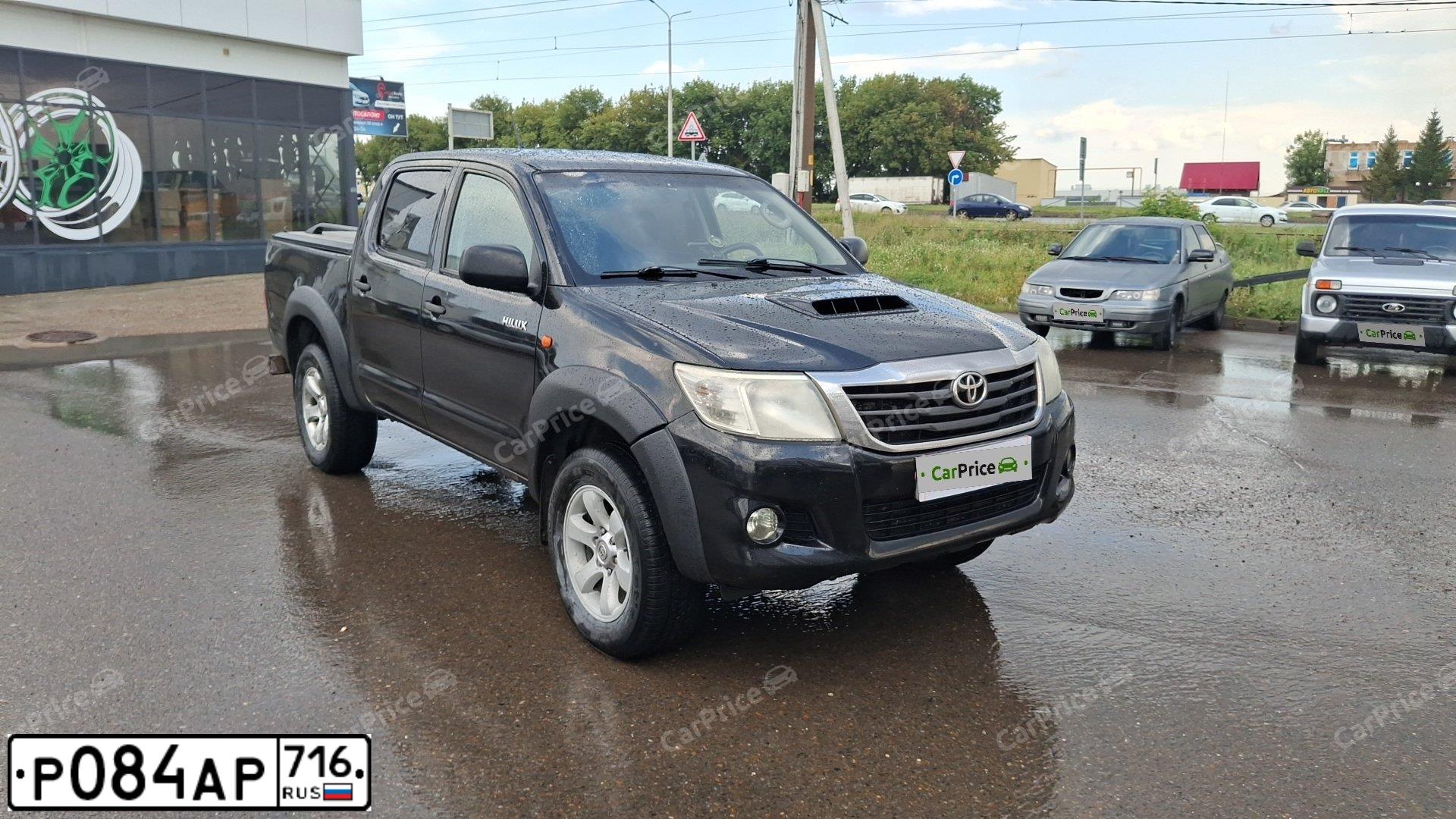 Фото автомобиля TOYOTA HILUX, 2014 — госномер Р084АР716. Цвет: ЧЕРНЫЙ
