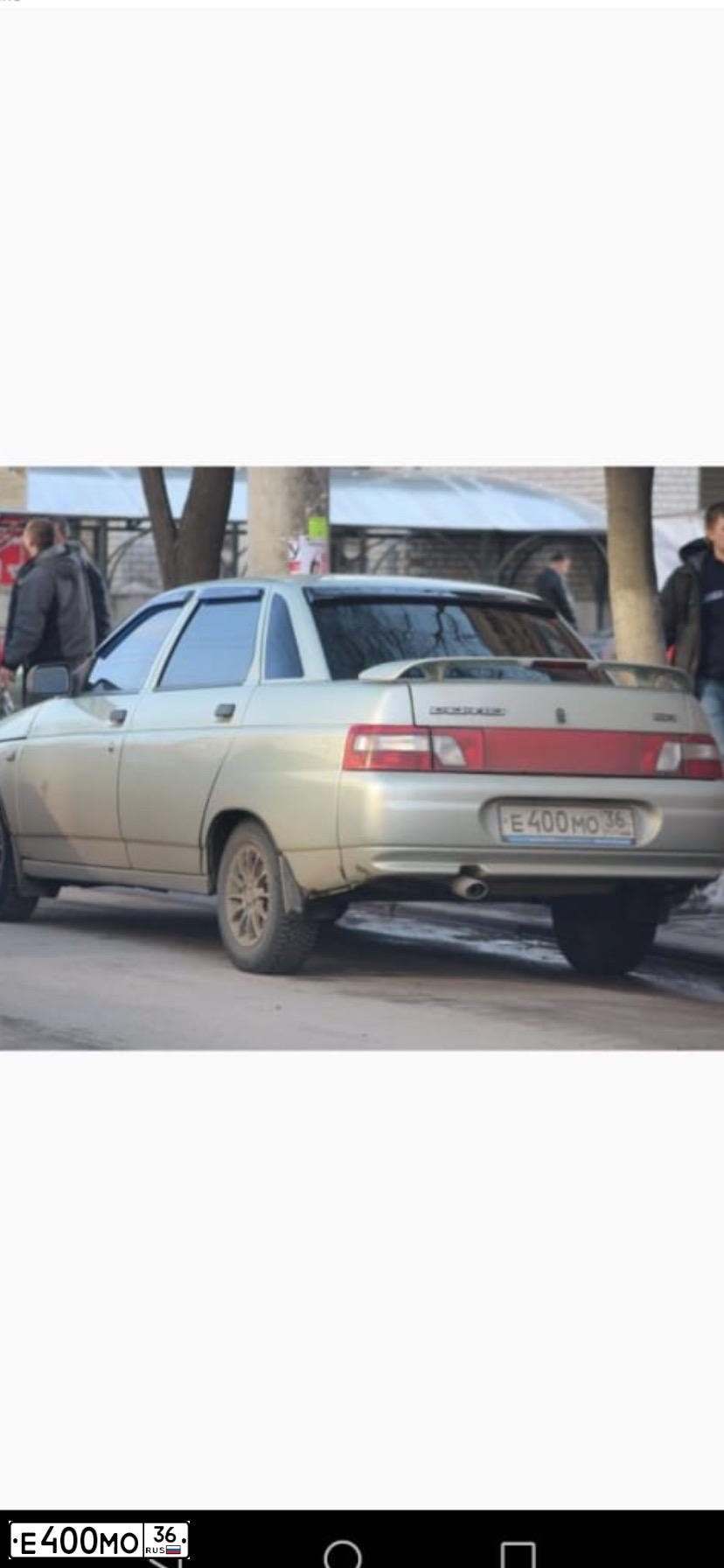 Фото автомобиля LADA 2110, 2006 — госномер Е400МО36. Цвет: БЕЛО-ЗЕЛЕНЫЙ