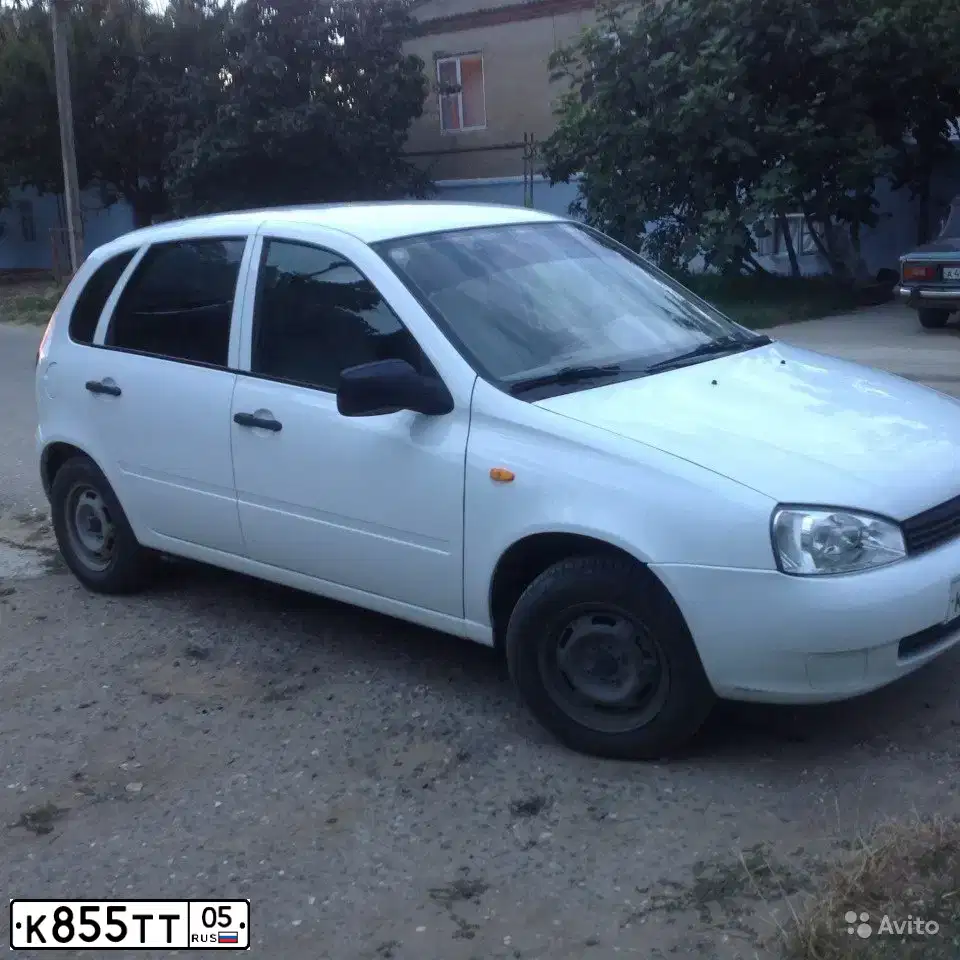 Фото автомобиля LADA 1119 KALINA, 2010 — госномер Е497НА73. Цвет: Белый