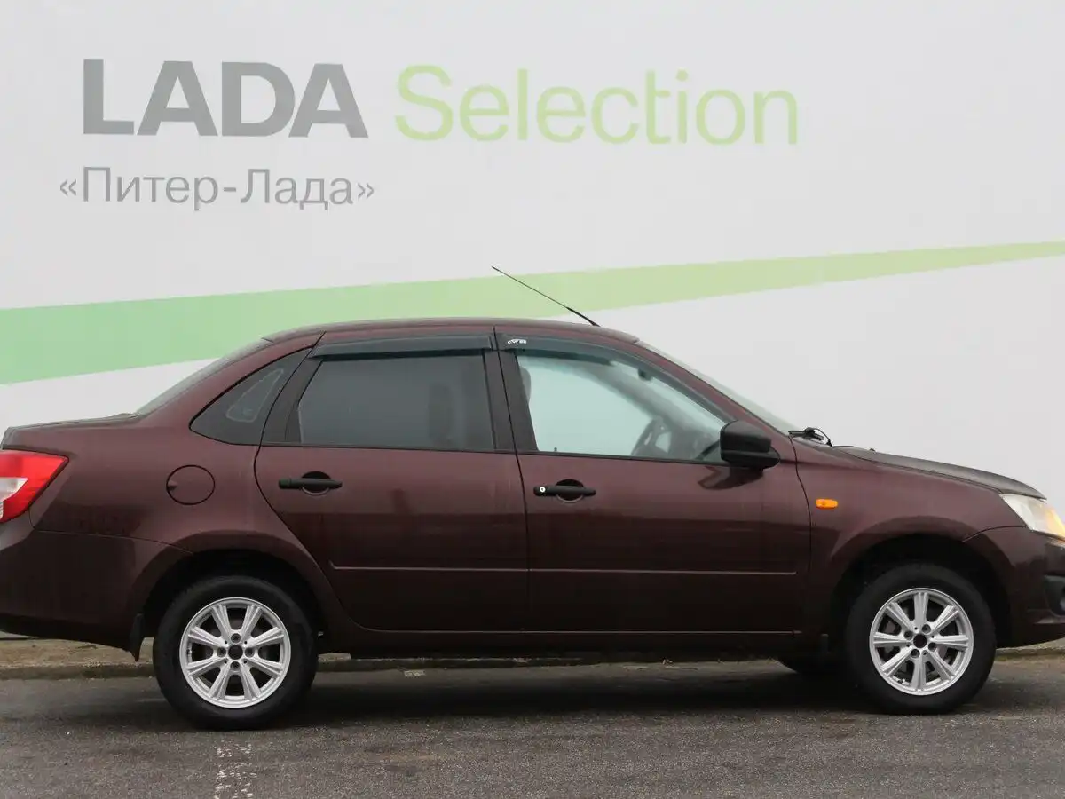 Фото автомобиля LADA GRANTA, 2015 — госномер К257ОО53. Цвет: ТЕМНО-ВИШНЕВЫЙ