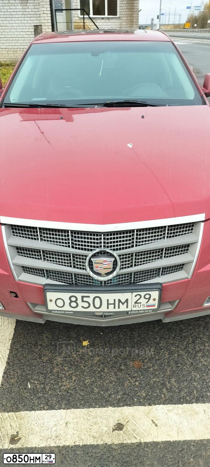 Фото автомобиля CADILLAC CTS, 2008 — госномер О850НМ29. Цвет: КРАСНЫЙ