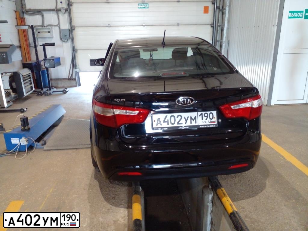 Фото автомобиля KIA RIO, 2012 — госномер Н283ТА33. Цвет: ЧЕРНЫЙ