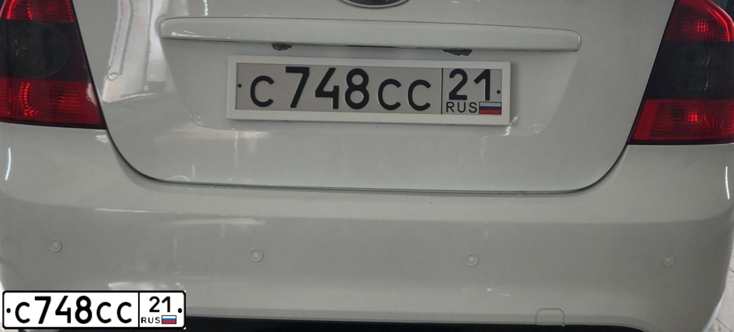 Фото автомобиля FORD FOCUS, 2010 — госномер С748СС21. Цвет: Белый