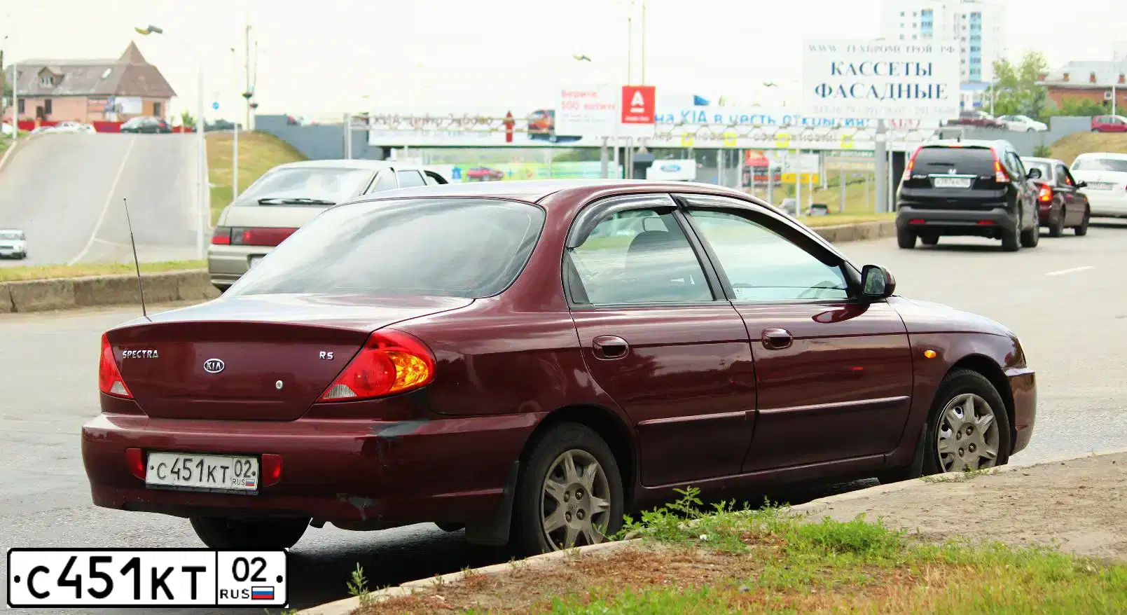 Фото автомобиля KIA SPECTRA, 2006 — госномер М547ХЕ763. Цвет: КРАСНЫЙ ПЕРЕЦ