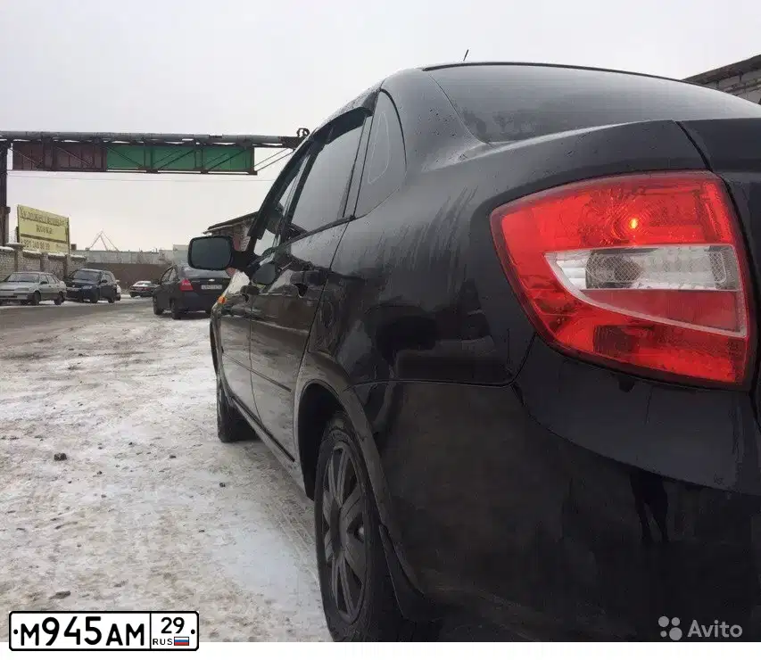 Фото автомобиля LADA 2190 GRANTA, 2014 — госномер М291ОЕ29. Цвет: Сине-Черный