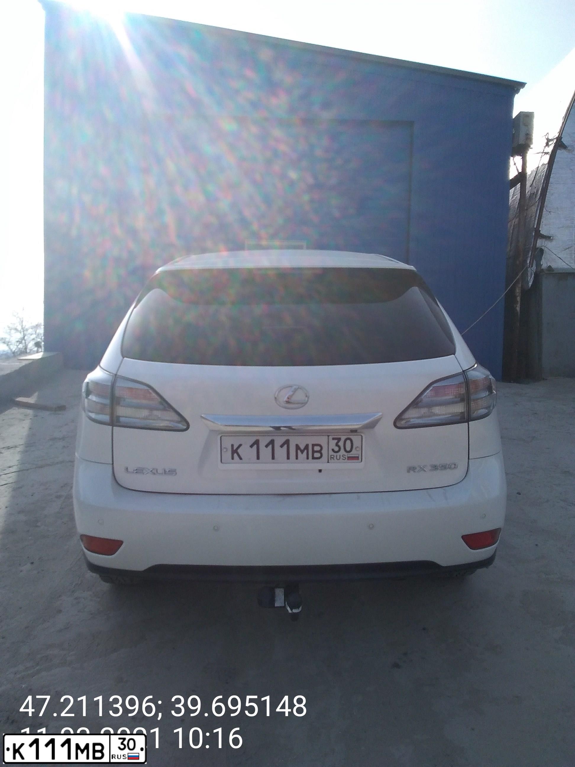 Фото автомобиля LEXUS RX, 2009 — госномер К111МВ30. Цвет: Белый