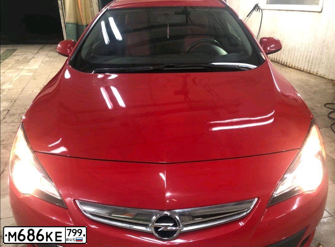 Фото автомобиля OPEL ASTRA, 2012 — госномер К192ЕР790. Цвет: Красный