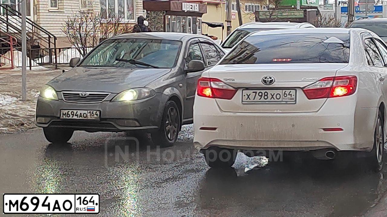 Фото автомобиля DAEWOO  GENTRA, 2013 — госномер Р835ОМ186. Цвет: ТЕМНО-СЕРЫЙ