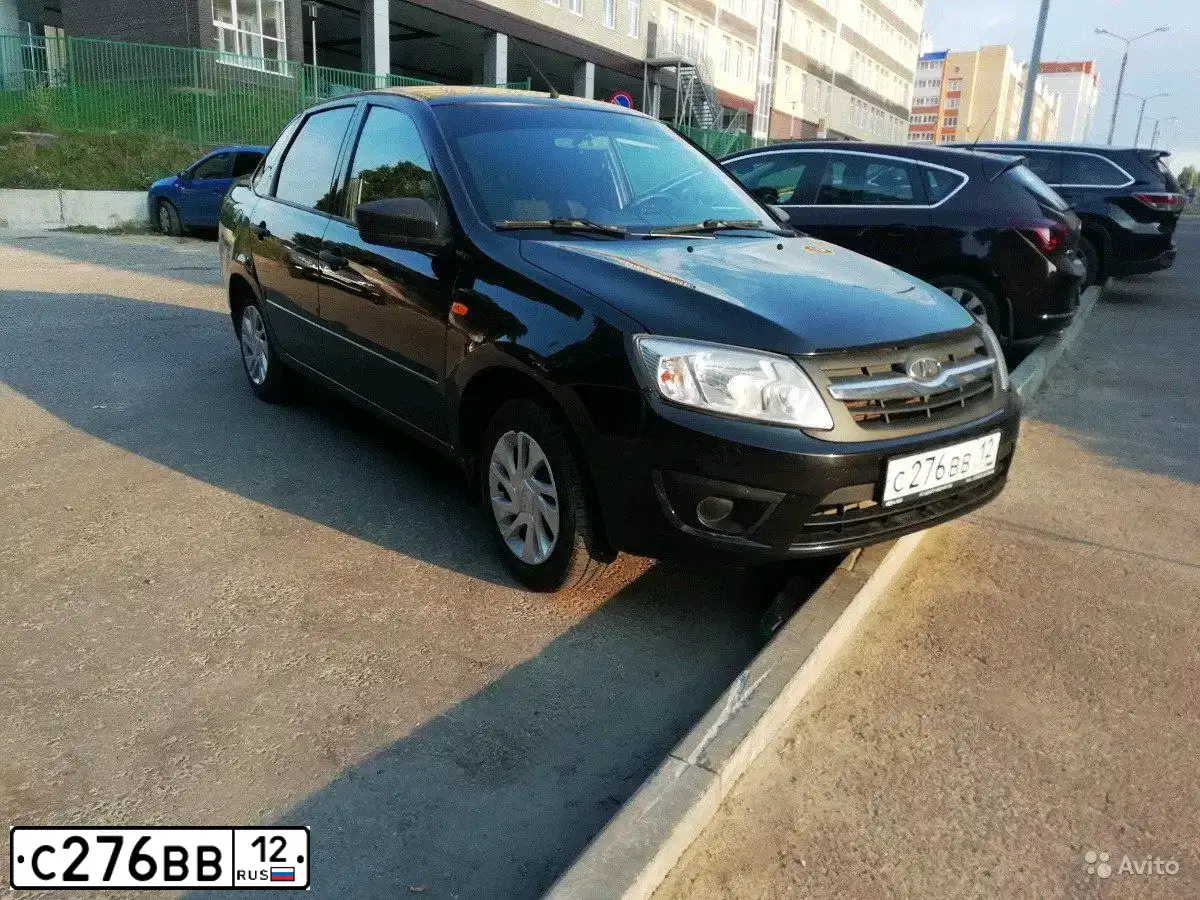 Фото автомобиля LADA 2190 GRANTA, 2015 — госномер К015РК12. Цвет: ЧЕРНЫЙ