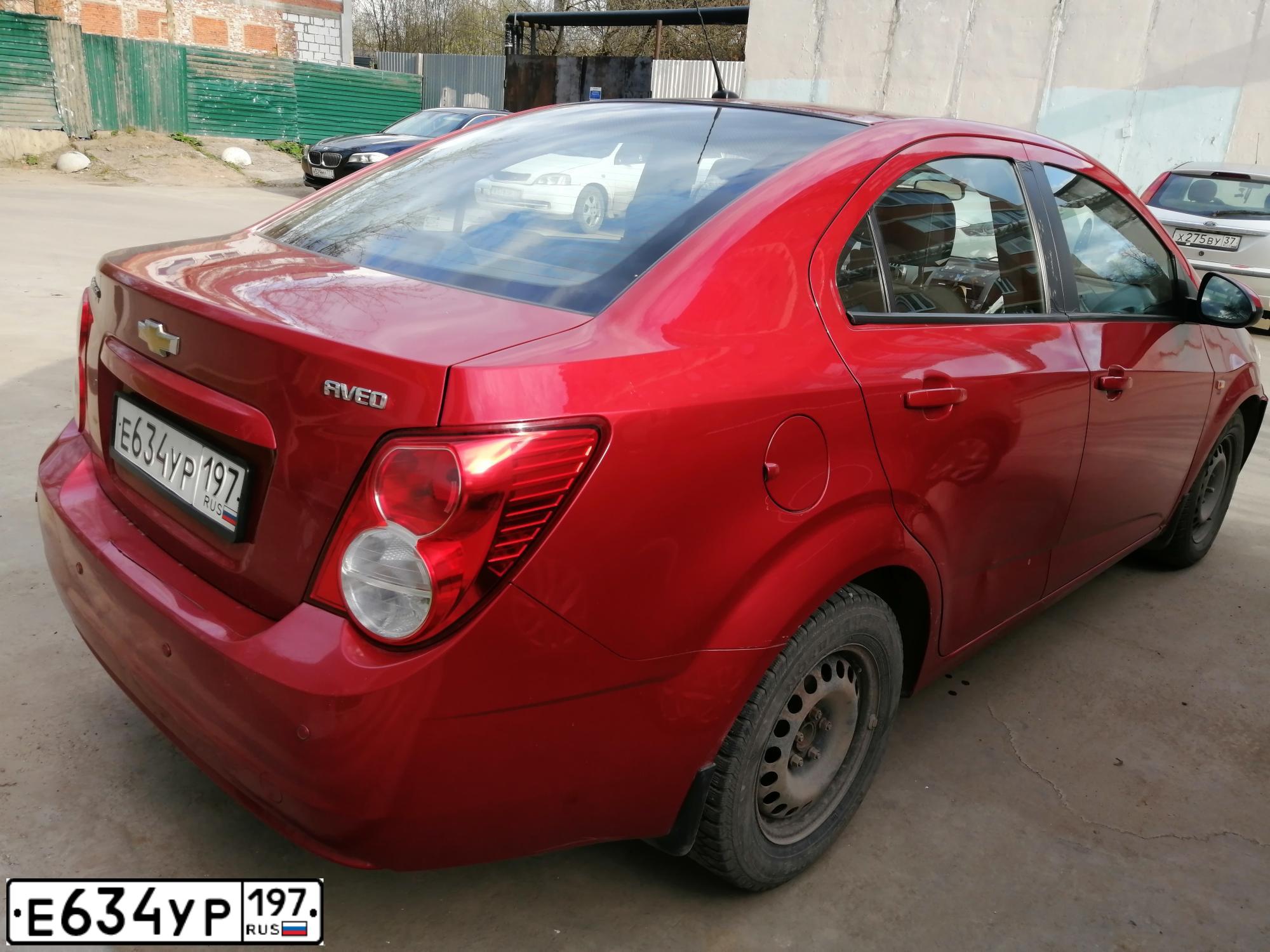Фото автомобиля CHEVROLET AVEO, 2012 — госномер Т419ТХ62. Цвет: Красный