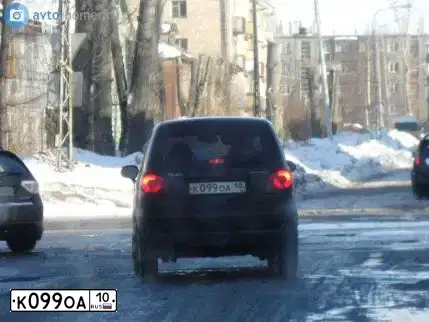 Фото автомобиля FORD FOCUS, 2011 — госномер К099ОА10. Цвет: Красный