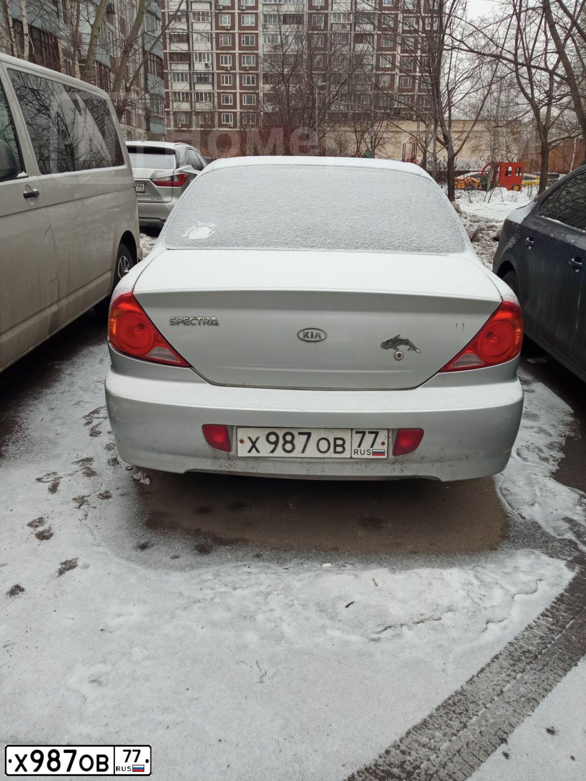 Фото автомобиля KIA SPECTRA, 2008 — госномер Х987ОВ77. Цвет: СЕРЫЙ