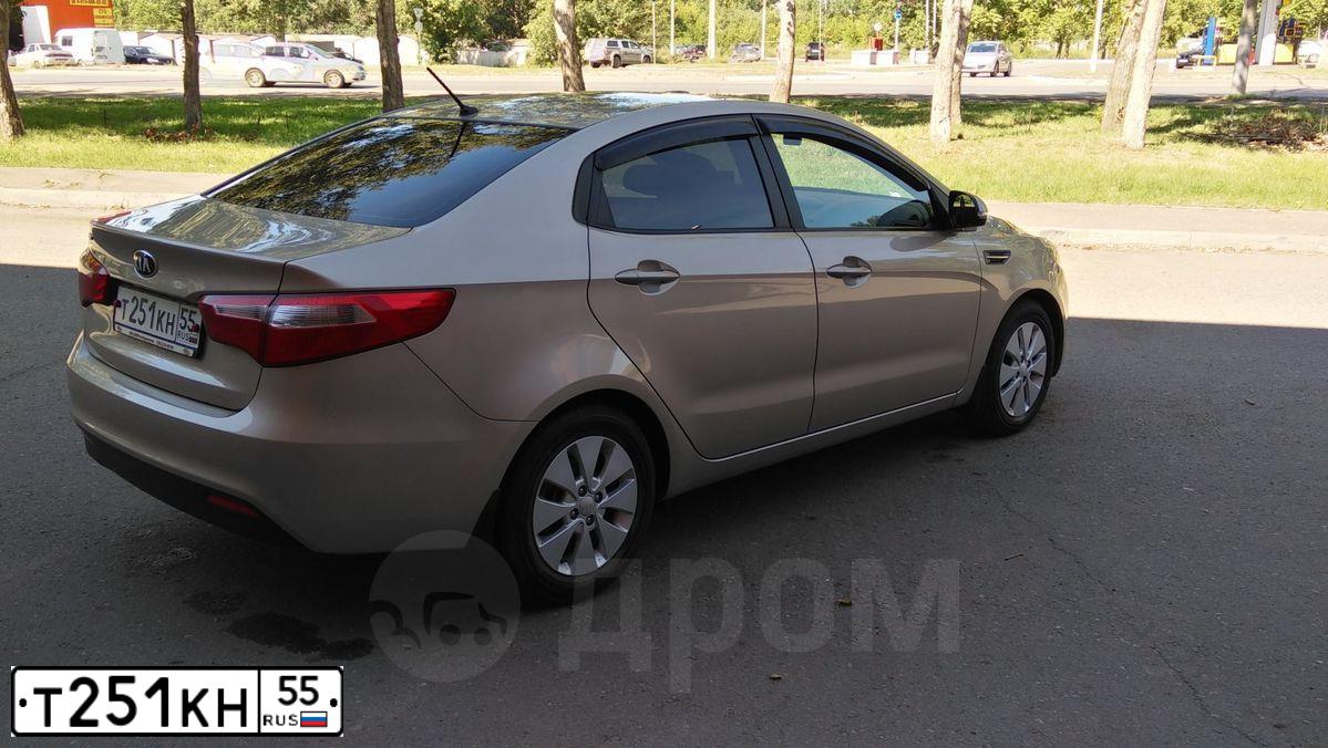 Фото автомобиля KIA RIO, 2014 — госномер Т251КН55. Цвет: БЕЖЕВЫЙ
