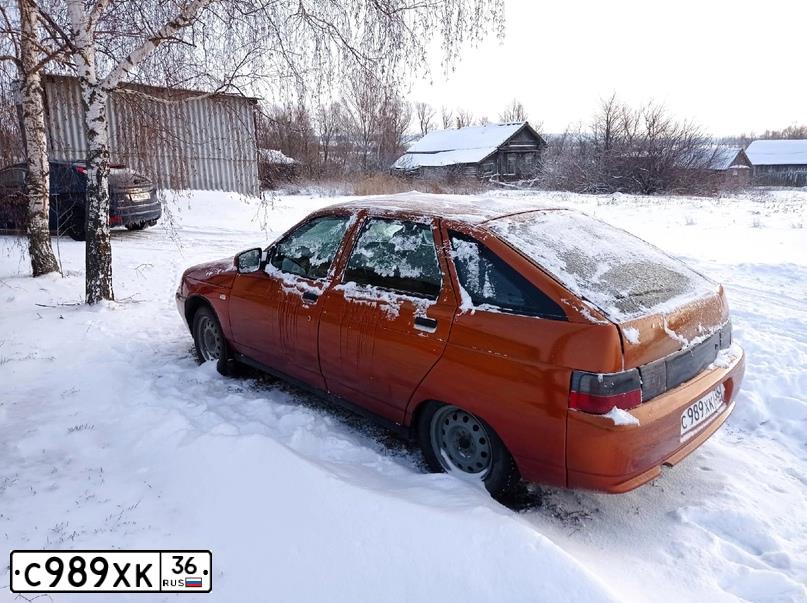 Фото автомобиля LADA 2112, 2004 — госномер Е469ММ48. Цвет: КРАСНО-ОРАНЖЕВЫЙ