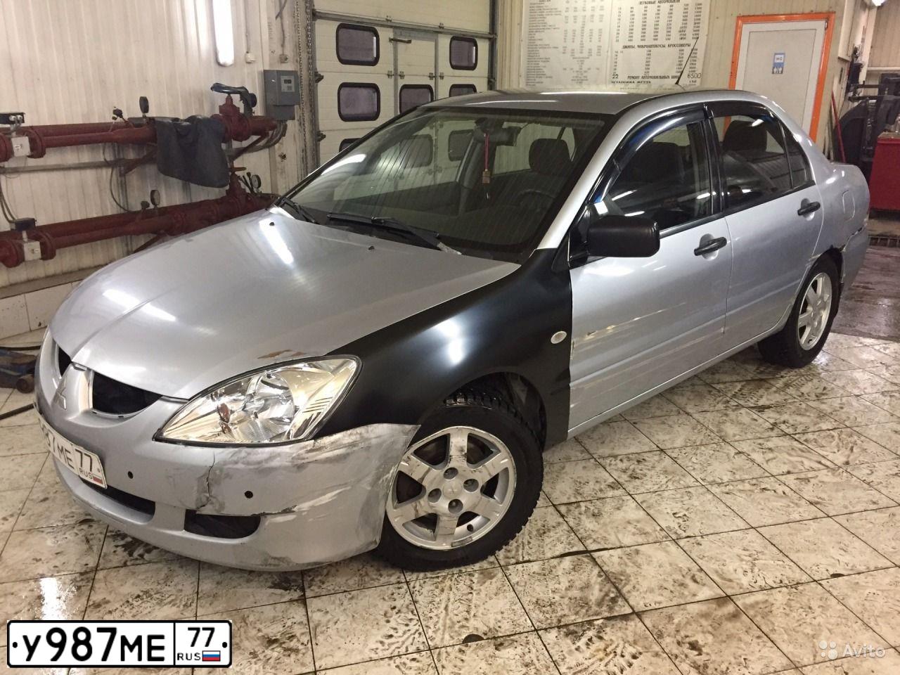 Фото автомобиля MITSUBISHI LANCER, 2003 — госномер С985АУ55. Цвет: Серебристый