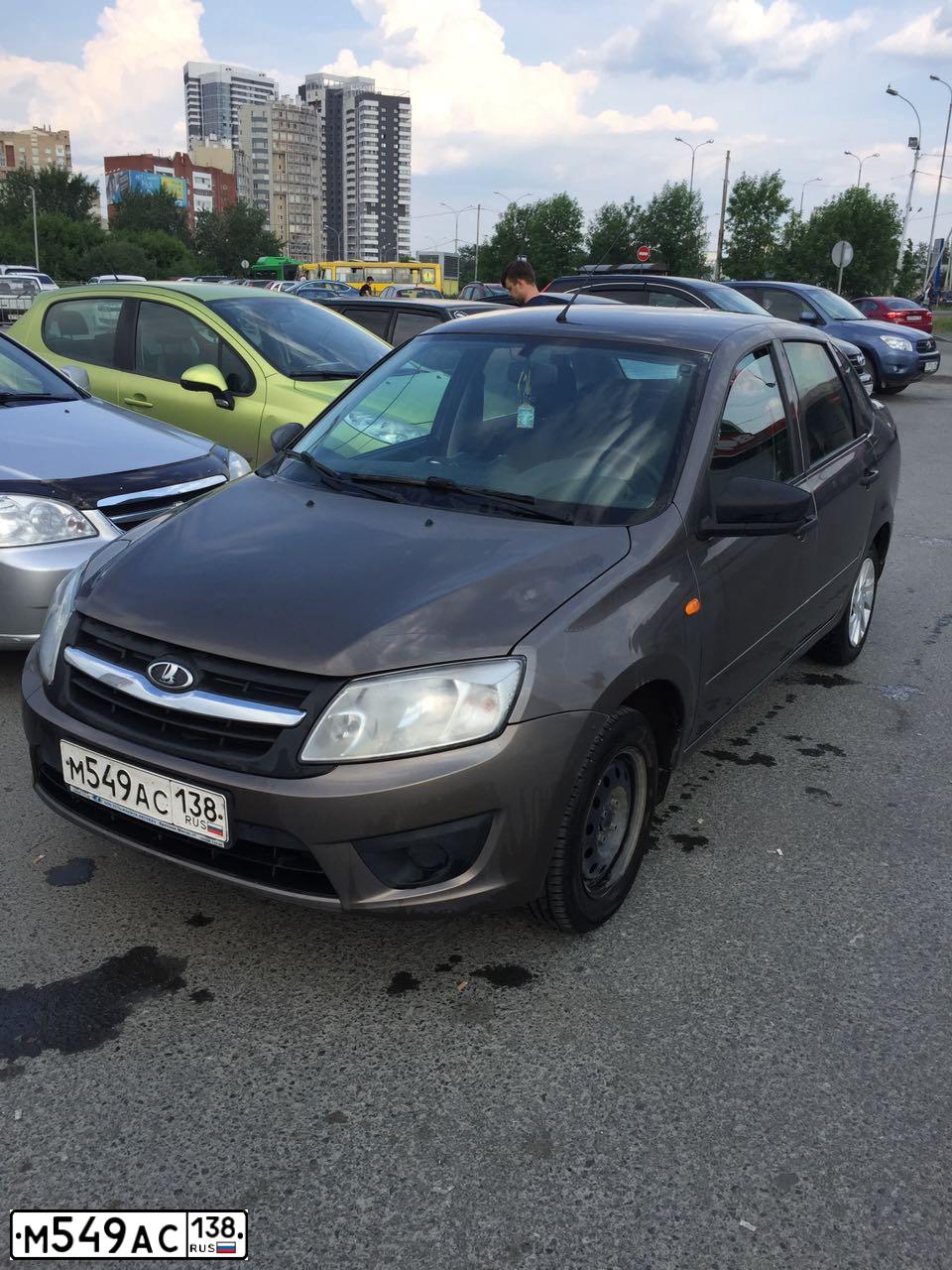 Фото автомобиля LADA 2190 GRANTA, 2015 — госномер М549АС138. Цвет: Коричневый