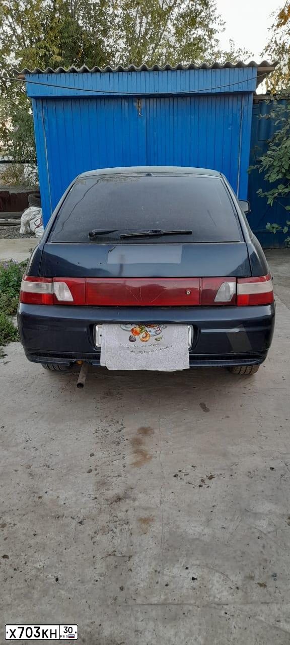 Фото автомобиля LADA 2112, 2004 — госномер Х703КН30. Цвет: сине-зеленый